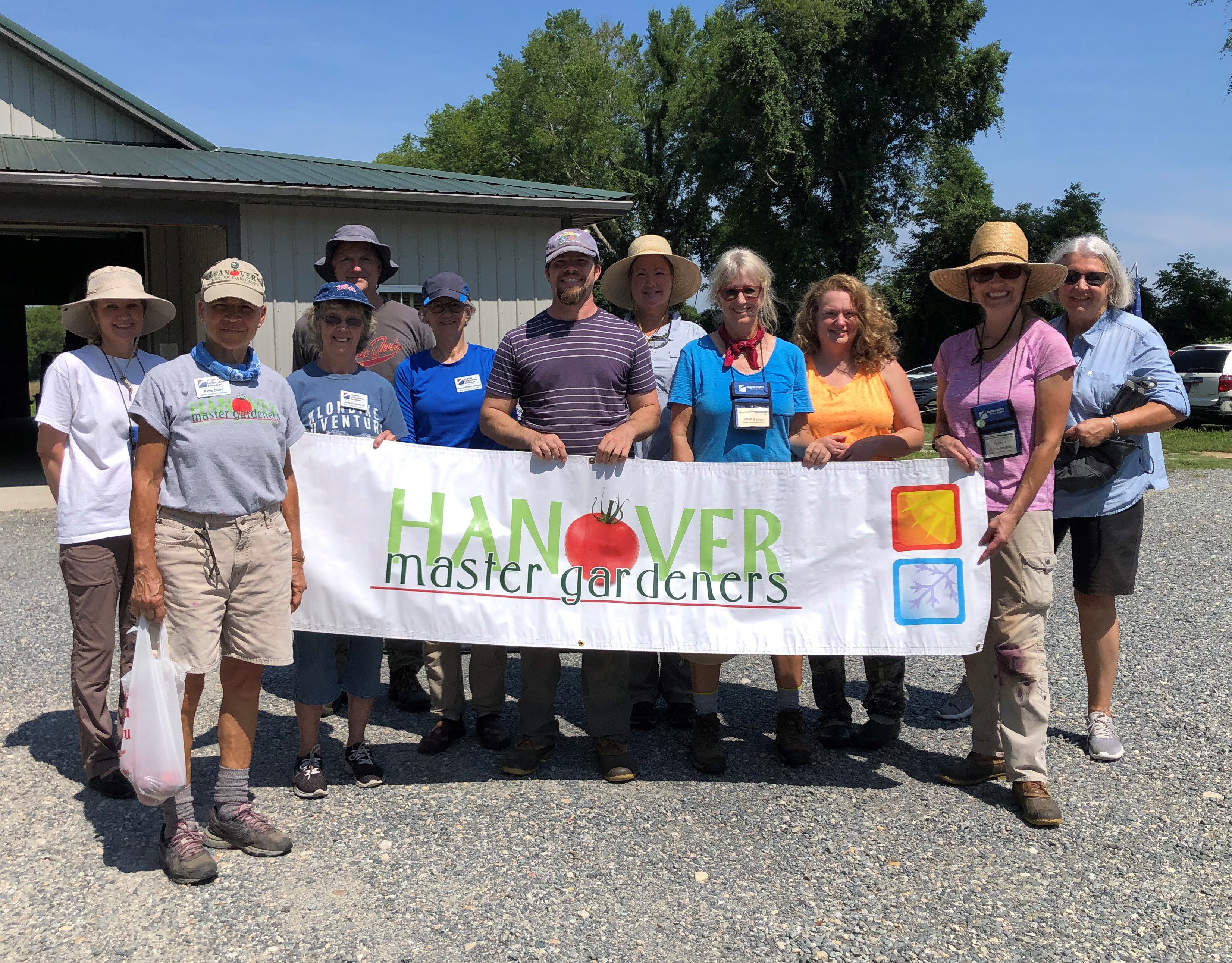 Master gardeners holding logo banner